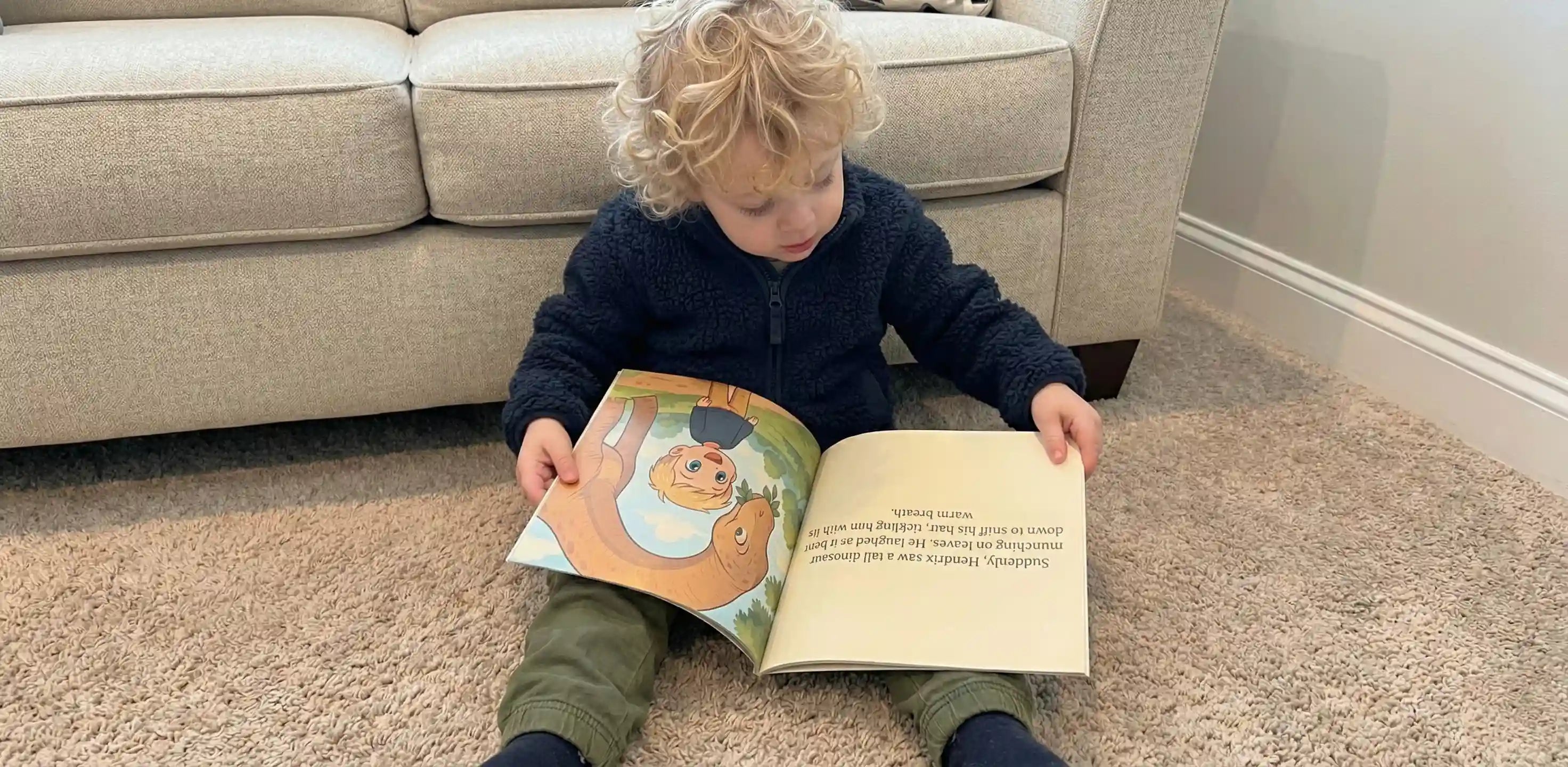Happy child reading personalized children's book featuring themselves as the main character.